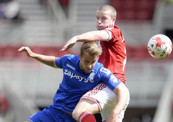 Middlesbrough's Grant Leadbitter, top, duels with Birmingham's Andrew Shinnie (Picture: Owen Humphreys/PA Wire).