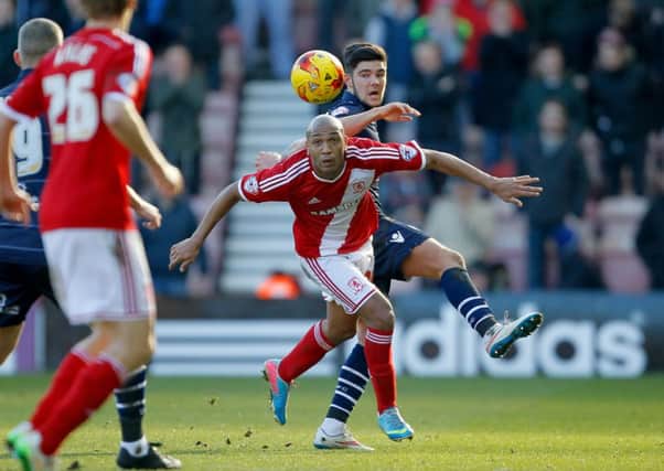 Alex Mowatt battles for the ball with Middlesbrough's Emilio Nsue.