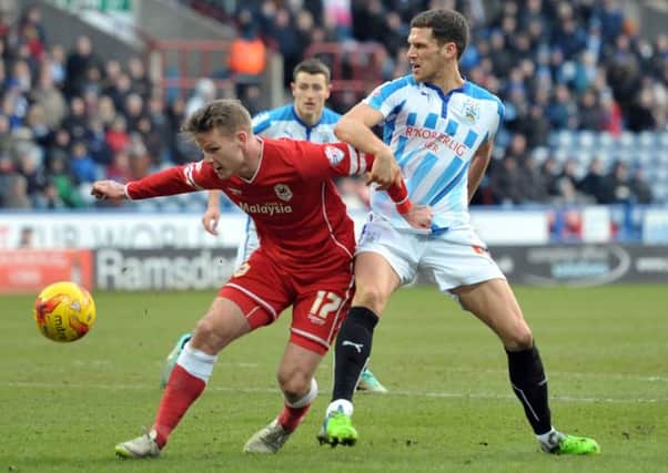 Huddersfield Towns Mark Hudson, a  former Cardiff captain, blocks Aron Gunnarsson (Picture: Graham Crowther).