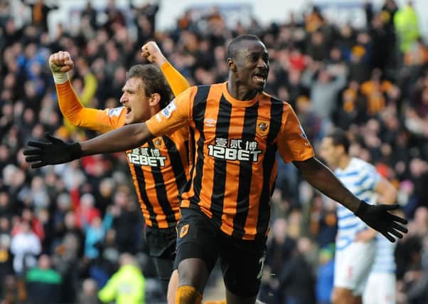 Dame N'Doyle celebrates his late winner against QPR, along with his fellow goalscorer on the day, Nikica Jelavic (Picture: Ryan Browne/PA Wire).