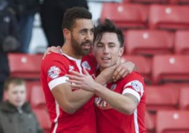 Lewin Nyatanga is congratulated by John O'Sullivan after scoring Barnsley's first goal against Crewe (
Picture: Dean Atkins).
