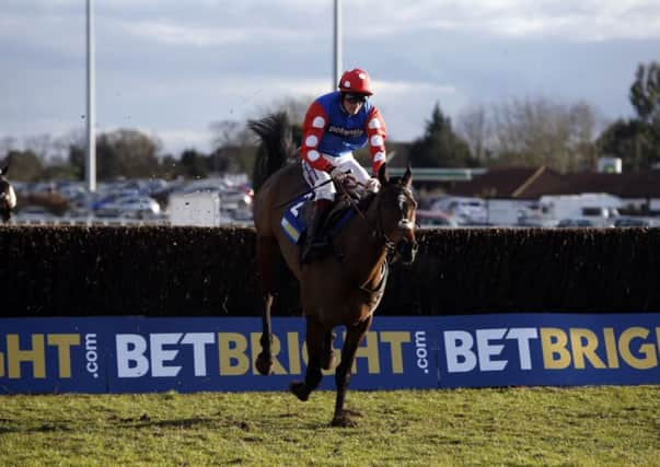 FRONT FOOT: Rocky Creek ridden by Sam Twiston-Davies jumps the last fence to win the BetBright Chase at Kempton. Picture: Steve Parsons/PA.