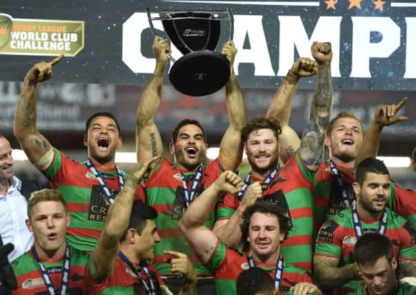 South Sydney Rabbitohs' lift the World Club Series trophy after thrashing St Helens. Picture: PA.