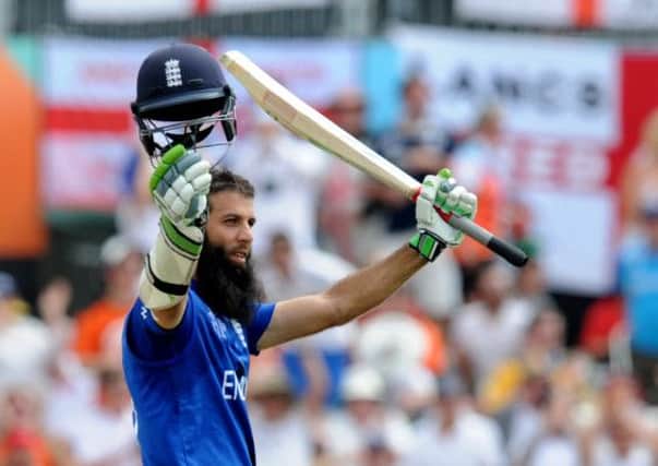 England's Moeen Ali waves to the crowd after reaching a century in the win over Scotland in Christchurch, New Zealand (Picture: Ross Setford/AP).