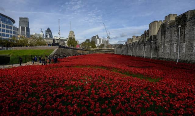 Blood Swept Lands and Seas of Red at the Tower of London last year, which theatre designer Tom Piper, below, helped to create.