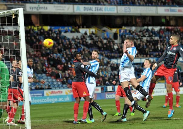 Harry Bunn heads home Huddersfield Town's opening goal in their 3-0 win against Reading (
Picture: Graham Crowther).