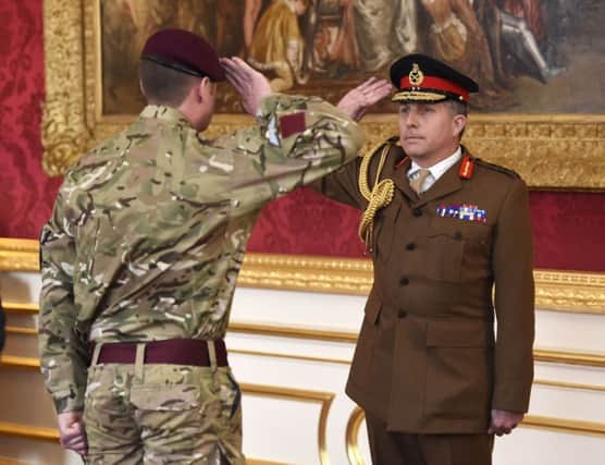 Lance Corporal Joshua Mark Leakey of the Parachute Regiment is saluted by Chief of the General Staff, General Sir Nicholas Carter, after he was named as being awarded the Victoria Cross