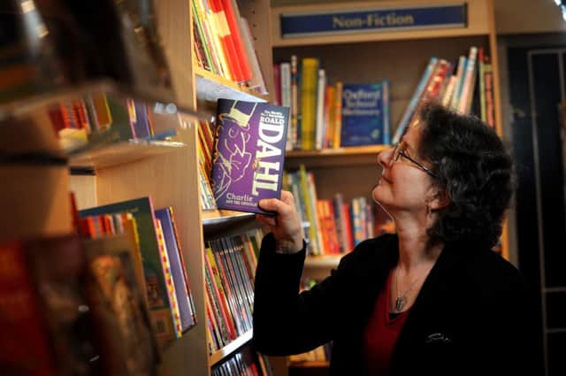 Carol Peel. manager of The Grove Bookshop, Ilkley, in the Children's section of the shop. Picture by Simon Hulme