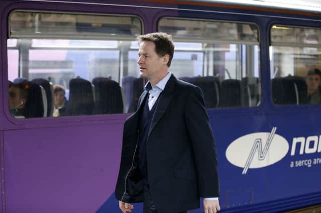 Nick Clegg during a visit to Sheffield train station. Rail passengers in northern England have been promised more seats, more services and new trains under franchise plans announced by the Government.