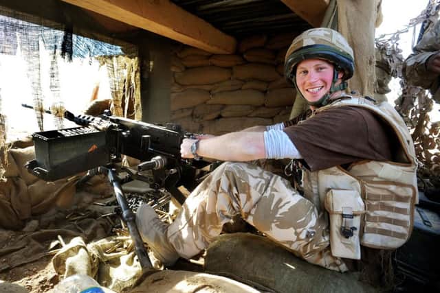Prince Harry manning the 50mm machine gun on the observation post at JTAC Hill, close to FOB Delhi in Helmand province, Southern Afghanistan, in 2008.