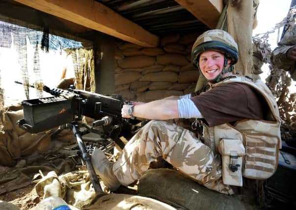 Prince Harry manning the 50mm machine gun on the observation post at JTAC Hill, close to FOB Delhi in Helmand province, Southern Afghanistan, in 2008.