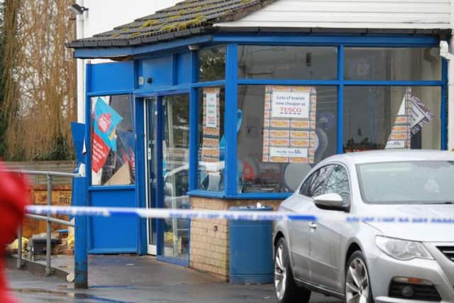This Tesco store in Crowle was sealed off by police after raiders using a mechanical digger struck to steal a cash machine.