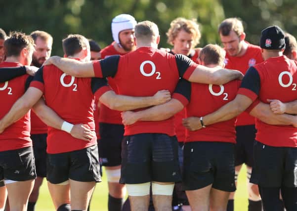 England players engage in a group huddle during yesterdays training session at Pennyhill Park Hotel, Bagshot, Surrey. Tomorrow, head coach Stuart Lancasters side will face Ireland in Dublin (Picture: Mike Egerton/PA).