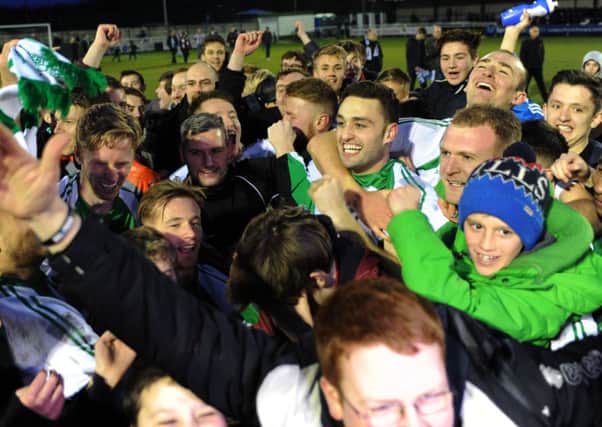 North Ferriby United players and fans celebrate their penalty shoot-out victory over Bath (Picture: Jonathan Gawthorpe).