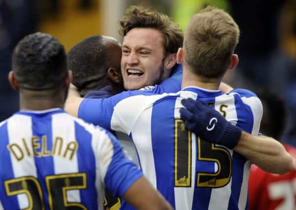 Will Keane celebrates with team-mates after heading in Sheffield Wednesday's second goal against Middlesbrough (Picture: Steve Ellis).
