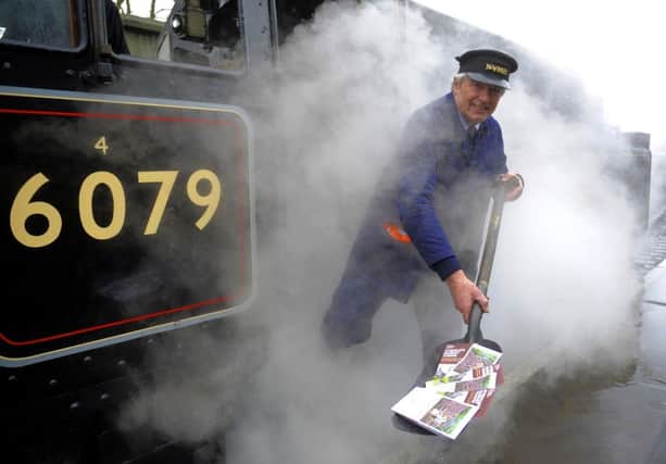 North Yorkshire Moors Railway driver, Charlie Wood steams into Pickering with a supply of the new leaflet promoting the market towns of Ryedale