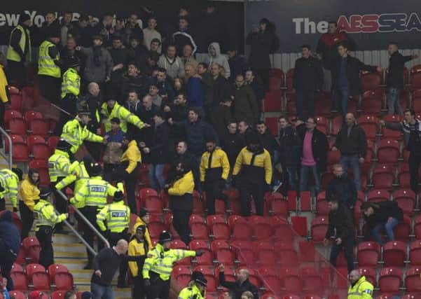 Trouble flares up with the away fans after Millwall fall behind to the Millers