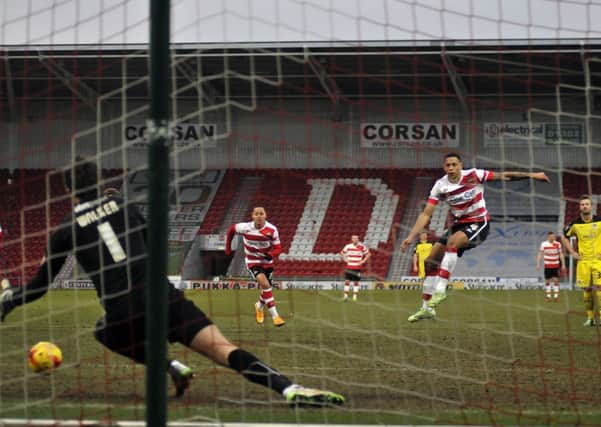 Doncaster 

Rovers' Nathan Tyson blasts home the penalty which sealed their 2-0 win over Colchester (Picture: Steve Uttley).