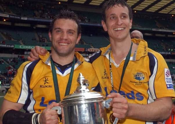 Yorkshire Carnegie, in a previous incarnation as Leeds Tykes, won the Powergen Cup, seen held by Diego Albanese and Alan Dickens. If the RFU introduce ring-fencing, Carnegie could find their past paves the way for a place in the Premiershi (Picture: Gerard Binks).