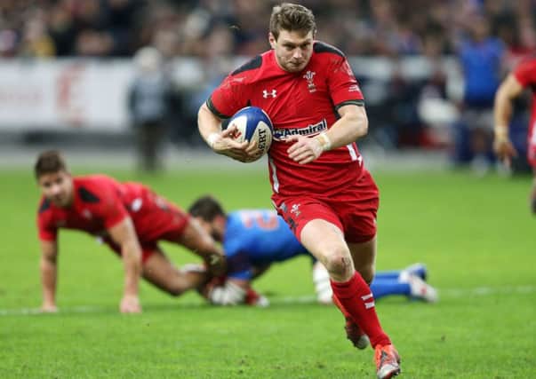 Wales Dan Biggar breaks away to score their first try during the RBS Six Nations match at the Stade de France, Paris, France.