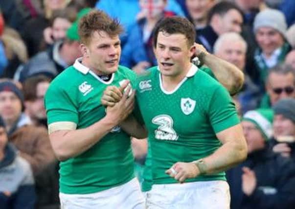 Ireland's Robbie Henshaw (right) is congratulated on scoring their first try during the RBS Six Nations match at the Aviva Stadium, Dublin.