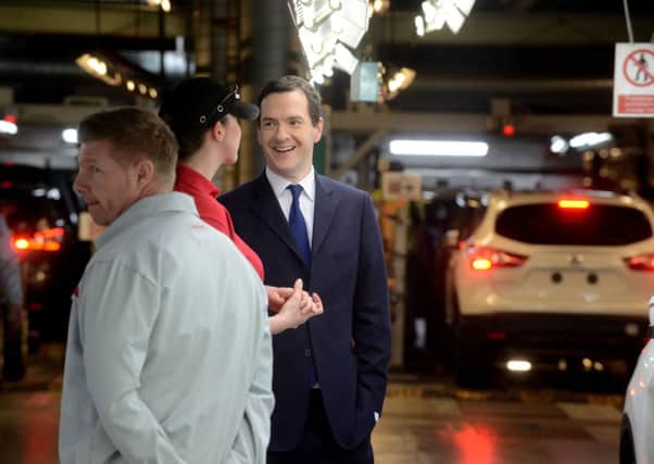 Chancellor George Osborne being shown car manufacturing during a tour of Nissan, Sunderland on Friday.