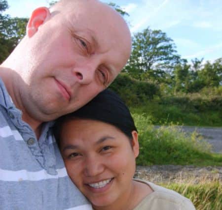 Carl Hendrickson with his wife Nittaya, who died with her newborn son Chester after being admitted to be induced at Furness General Hospital in 2008