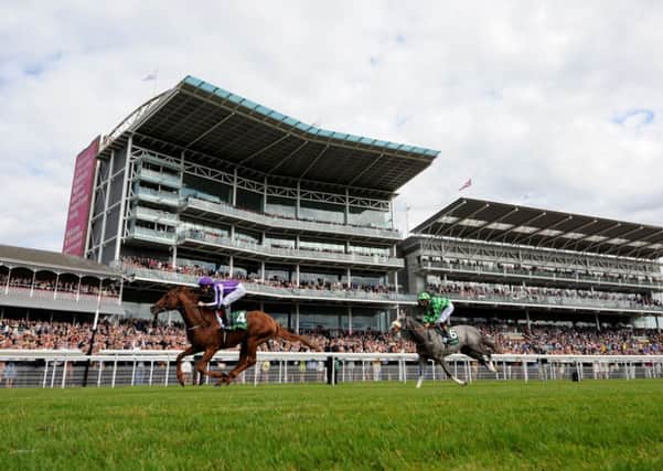 Australia ridden by Joseph O'Brien wins the Juddmonte International Stakes during Day One of the 2014 Welcome To Yorkshire Ebor Festival at York