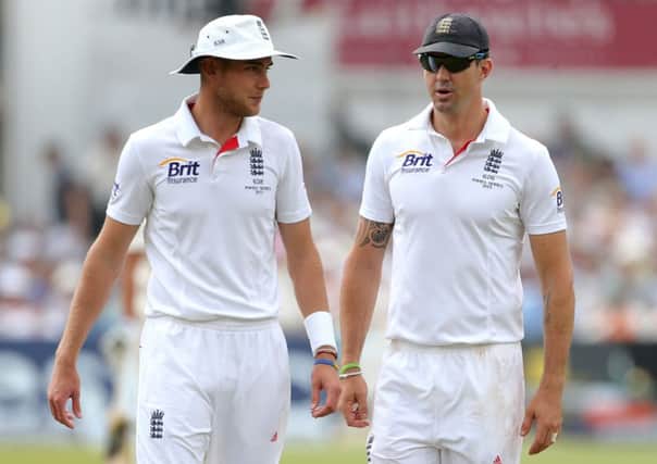 Stuart Broad talks with Kevin Pietersen while playing for England.
