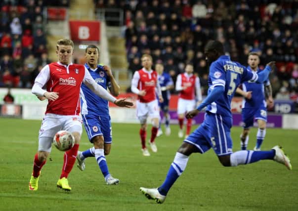 Rotherham's Danny Ward, left, who scored a late consolation, in action against Cardiff last night.