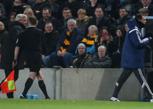Hull City manager Steve Bruce shouts towards Sunderland manager Gus Poyet as Poyet is sent to the stands off by referee Mike Dean during the Barclays Premier League match at the KC Stadium, Hull. (Picture: Lynne Cameron/PA Wire).