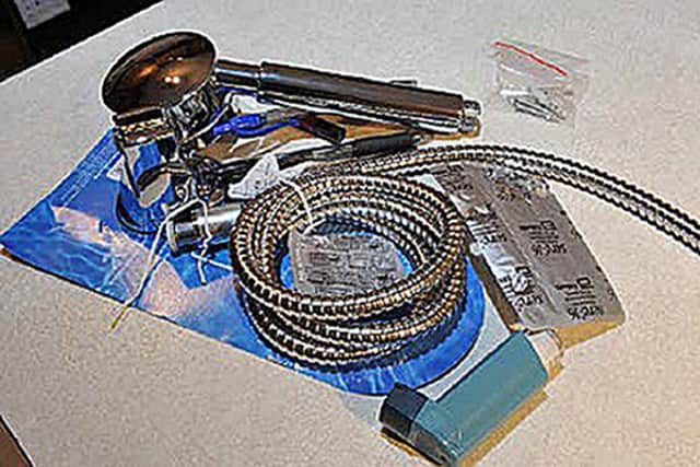A new shower hose and fitting purchased by Kiki Muddar found inside the flat at Bedwell Court; it is believed this was a replacement for one that had been used to assault Ayesha Ali