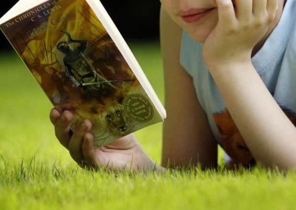 A child enjoying reading a book... which is what World Book Week should essentially be all about.