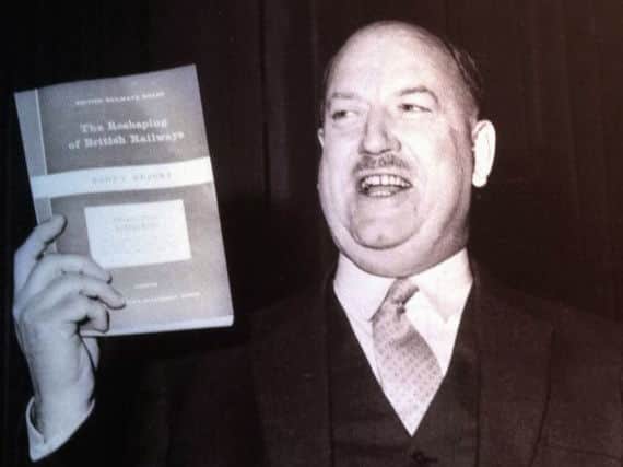 Dr Beeching holding his report from 1963