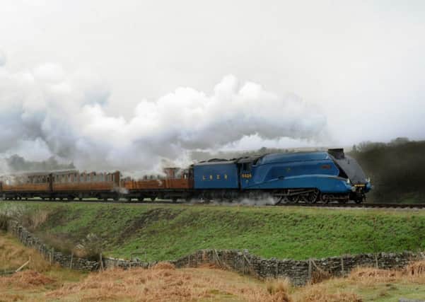 Bittern, a London and North Eastern Railway Class A4 steam locomotive, makes its way out of Goathland towards Pickering on the North York Moors Railway