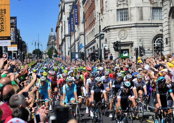 Mark Cavendish leads the cyclists down the Headrow at the Start of the Tour De France 6th July 2014 Picture by Simon Hulme