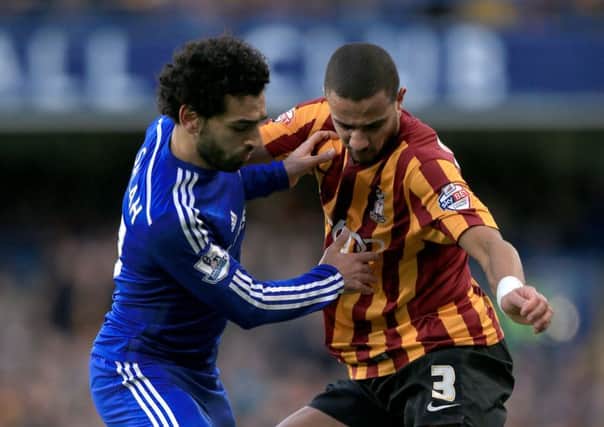 Chelsea's Mohamed Salah (left) battles for the ball with Bradford City's James Meredith during the FA Cup Fourth Round match at Stamford Bridge