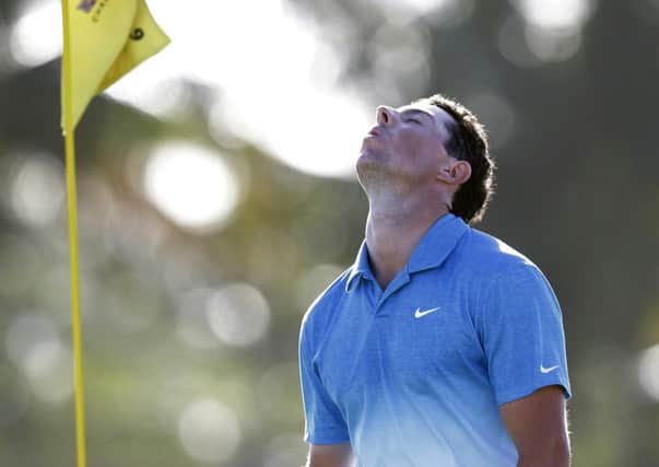 Rory McIlroy of Northern Ireland, reacts after finishing the first round of the Cadillac Championship golf tournament. (AP Photo/Wilfredo Lee)