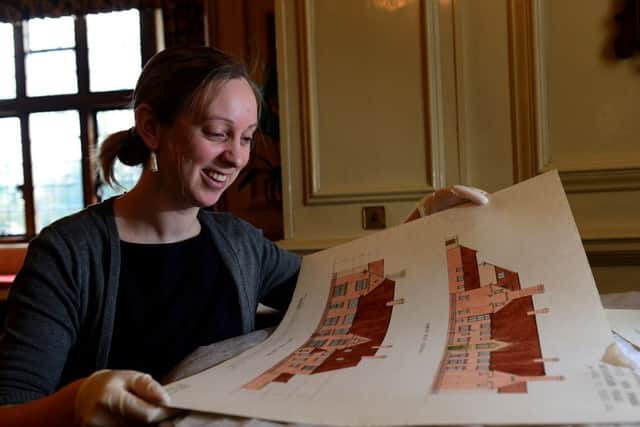 Claire Fletcher with some original architect drawings