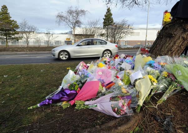Floral tributes at the scene.