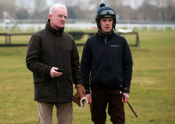 Trainer Willie Mullins with Ruby Walsh on the gallops at Cheltenham Racecourse.