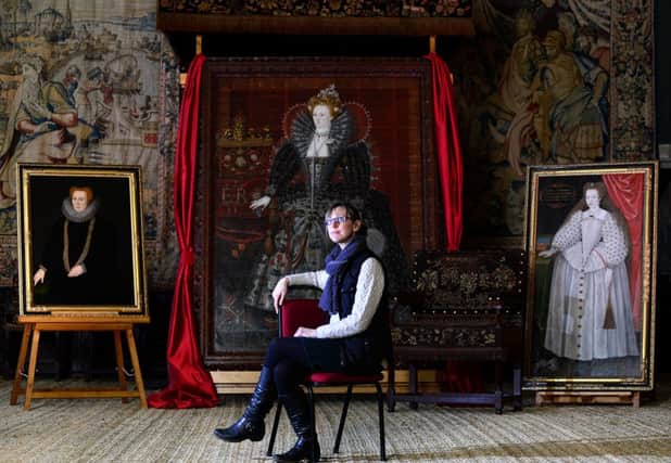The National Trust's Rachel Albanese with portraits of  Beth of Hardwick, Queen Elizabeth I and Arbella Stuart
