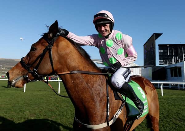 Ruby Walsh celebrates his  victory on Faugheen in the Stan James Champion Hurdle Challenge Trophy.