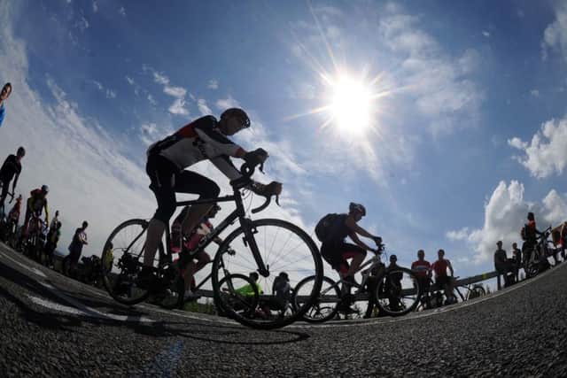 Cyclists tackle Holme Moss on last year's Tour de France Grand Depart