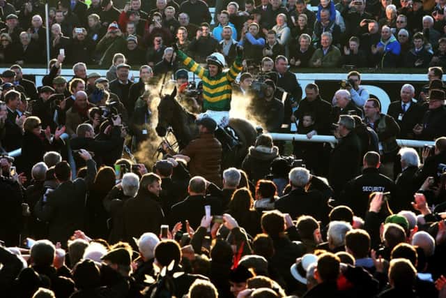 REPEAT: Tony McCoy aboard Carlingford Lough after winning the Hennessy Gold Cup at Leopardstown. Picture: Brian Lawless/PA Wire