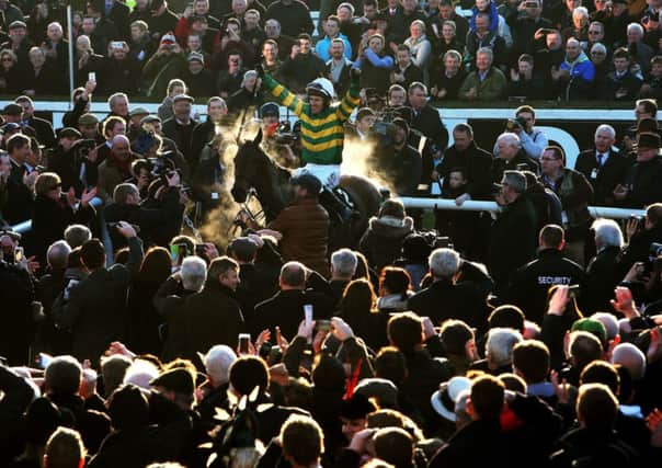 REPEAT: Tony McCoy aboard Carlingford Lough after winning the Hennessy Gold Cup at Leopardstown. Picture: Brian Lawless/PA Wire