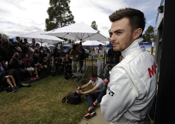 BEING THERE: Manor driver Will Stevens poses for photographers ahead of the Australian Formula One Grand Prix in Melbourne Picture: AP/Ross Land.