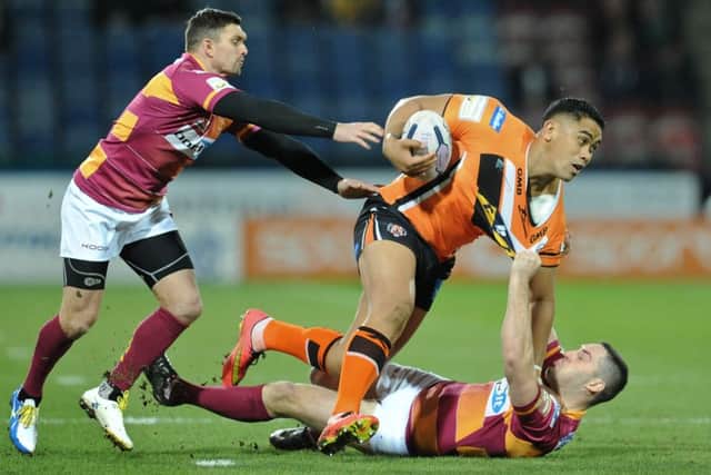 GOING NOWHERE: Huddersfield Giants' Danny Brough, left, and Joe Wardle, right, tackle Castleford's Junior Moors.