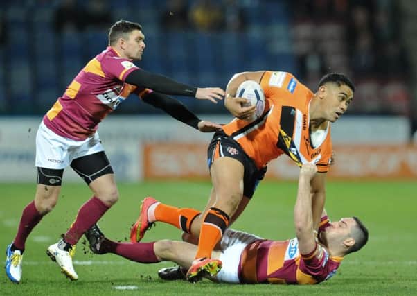 GOING NOWHERE: Huddersfield Giants' Danny Brough, left, and Joe Wardle, right, tackle Castleford's Junior Moors.