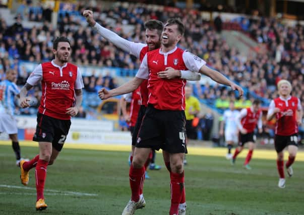 Rotherham's Kari Arnason is congratulated by Kirk Broadfoot as Matt Derbyshire (left) runs to join the celebrations